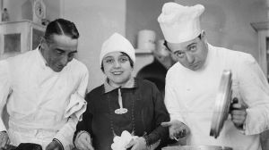 Opera singer Toti dal Monte with two chefs cooking, New South Wales, ca. 1928, 2 [picture]. [nla.pic-vn6296845]