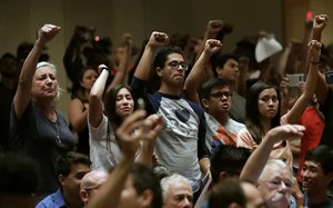 Protestors shout down White Nationalist Richard Spencer during a speech Thursday, Oct. 19, 2017, at the University of Florida in Gainesville, Fla.