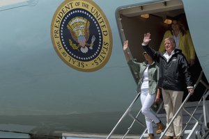 File - U.S. President Donald Trump and First Lady Melania Trump arrive at Muniz Air National Guard Base, Carolina, Puerto Rico, Oct. 3, 2017.  Trump visted Puerto Rico following Hurricane Maria and met with local leadership regarding storm response efforts.