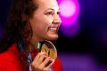 World-record holder: Kylie Masse of Canada poses with the gold meda.