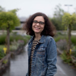 Crosscut's newest team member Lilly Fowler, photographed at UpGarden P-Patch Community Gardens in Seattle on June 15th.