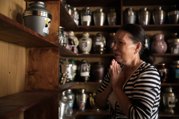 Kim Le mourns her grandson Tommy Le in front of his urn of ashes at Co Lam Pagoda Buddhist Temple in Seattle on Sunday, August 6, 2017. The 20-year-old Vietnamese-American man was shot and killed by King County Sheriff's department officers in Burien, a nearby suburb of Seattle, on June 13.