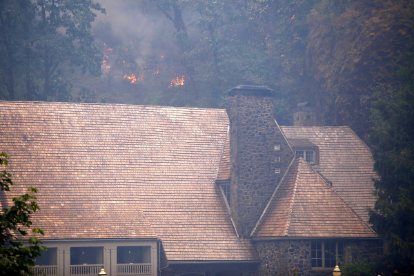 The Eagle Creek fire has been burning in the Columbia River Gorge since Sept. 2 and threatened the Multnomah Falls Lodge Tuesday, Sept. 5. The growing blaze east of Portland, Oregon, was one of dozens of wildfires burning in western U.S. states that sent smoke into cities from Seattle to Denver.