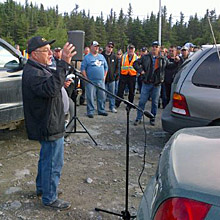 Electrician Kevin Slaney addresses workers gathered near the road to Long Harbour on Monday morning. 