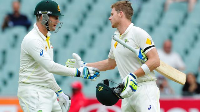 Passing the baton: Steve Smith, right, with Michael Clarke in the Test against India at Adelaide in 2014.
