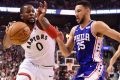 Toronto Raptors forward CJ Miles (left) drives to the net against Philadelphia 76ers guard Ben Simmons.