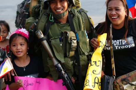 Relatives welcome home troops in one of the first battalions to be deployed in the besieged city of Marawi in southern ...