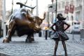 "Charging Bull" and "Fearless Girl" face off against each other in New York.