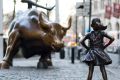 "Charging Bull" and "Fearless Girl" face off against each other in New York.