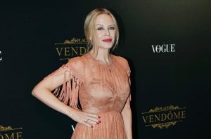 Kylie Minogue poses during the photocall for the Vogue Party during the Paris fashion week, in Paris, Sunday, Oct. 1, ...