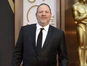 FILE - In this March 2, 2014 file photo, Harvey Weinstein arrives at the Oscars at the Dolby Theatre in Los Angeles. The Producers Guild of America has voted unanimously to institute termination proceedings for Harvey Weinstein. The PGA’s National Board of Directors and Officers said Monday, Oct. 16, 2017