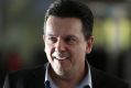 Senator Nick Xenophon arrives at Canberra Airport ahead of the Parliamentary sitting week, in Canberra on Sunday 15 ...