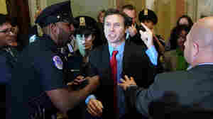 Protester Throws Russian Flags At Trump As He Arrives For Capitol Hill Tax Lunch