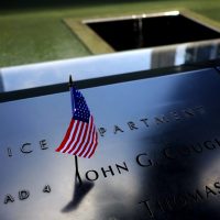 A United States flag is seen on a name at the Sept. 11 Memorial, Friday, June 30, 2017, in New York. (Julio Cortez/AP)