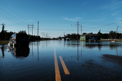 An abandoned car sits in high water along a street on Sept. 7, 2017 in Orange, Texas. (Spencer Platt/Getty Images)