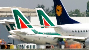 Lufthansa and Alitalia jetliners parked at the Milan Linate airport. Cerberus has joined the German airline in ...