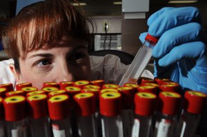 U.S. Air Force Tech. Sgt. Tracy Stewart, from the 28th Medical Support Squadron, verifies patient identification on blood samples at Ellsworth Air Force Base