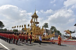 The symbolic urn is transported during the funeral procession of late Thai King Bhumibol Adulyadej in Bangkok, Thailand, Thursday, Oct. 26, 2017.