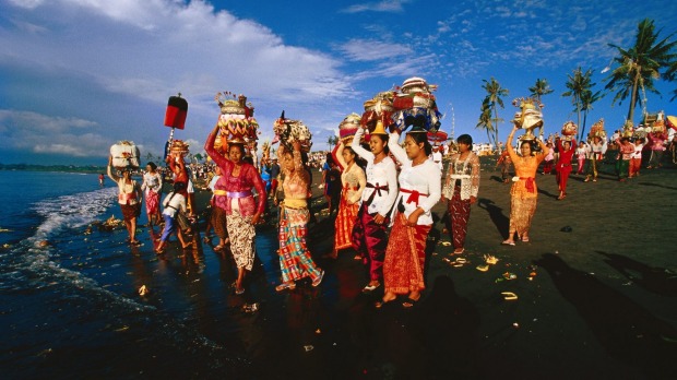 All together: Villagers take part in a ceremony in Bali.