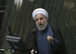 Iranian President Hassan Rouhani speaks while defending his three proposed ministers following a recent cabinet reshuffle, in an open session of parliament in Tehran, Iran, Tuesday, Nov. 1, 2016.