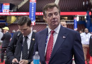 FILE - In this July 18, 2016, file photo, Trump campaign chairman Paul Manafort walks around the convention floor before the opening session of the Republican National Convention in Cleveland.