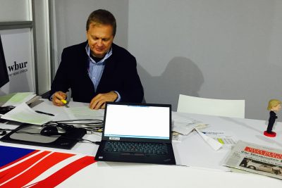 Host Tom Ashbrook preps for our first  morning broadcast in Cleveland at the Quicken Loans Arena, Monday, July 18, 2016. (Karen Shiffman/WBUR)