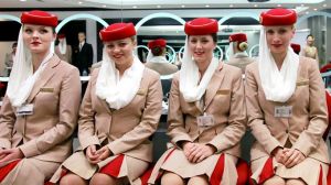 Flight attendant students for Emirates pose in the image and uniform classroom at the Emirates Aviation College in Dubai.