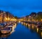 The canals of Leiden in The Netherlands are lined by handsome  houses.