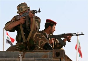 Iraqi army soldiers guard the Shalamcha border crossing with Iran, some 550 kilometers (340 miles) southeast of Baghdad, Iraq, Thursday, Feb. 15, 2007.