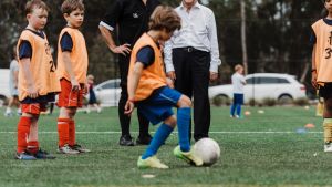 Smooth operators: Pennant Hills FC vice president Grahame Bateman and Hornsby mayor Phillp Ruddock on the synthetic field. 