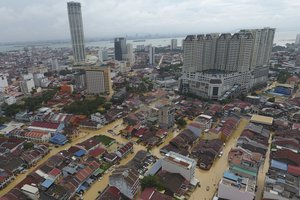 An aerial view shows a flooded George Town city in Penang, Malaysia, Sunday, Nov. 5, 2017. A northern Malaysian state has been paralyzed by a severe storm that led to two deaths and some 2,000 people evacuated in the worst flooding in years, officials say.