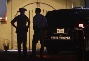 Law enforcement officials work at the scene of a shooting at the First Baptist Church of Sutherland Springs, Sunday, Nov. 5, 2017, in Sutherland Springs, Texas.