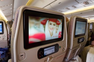 Entertainment system screens inside the cabin of a Emirates Boeing 777.