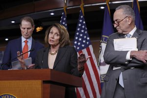 House Minority Leader Nancy Pelosi, D-Calif., flanked by Sen. Ron Wyden, D-Ore., the ranking member of the Senate Finance Committee, left, and Senate Minority Leader Chuck Schumer, D-N.Y., holds a news conference on Capitol Hill to respond to the Republican tax reform plan announced earlier, in Washington, Thursday, Nov. 2, 2017. (AP Photo/J. Scott Applewhite)