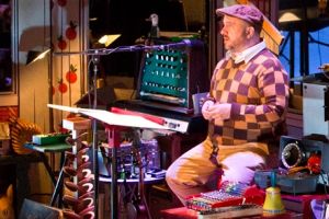 Magnetic Fields frontman Stephin Merritt performs cordoned off from his band.