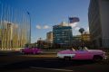 Tourists ride in classic American convertible cars past the United States embassy, right, in Havana, Cuba. The US has ...