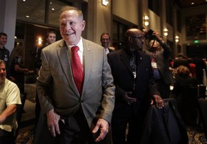 Former Alabama Chief Justice and U.S. Senate candidate Roy Moore, greets supporters before his election party, Tuesday, Sept. 26, 2017, in Montgomery, Ala.