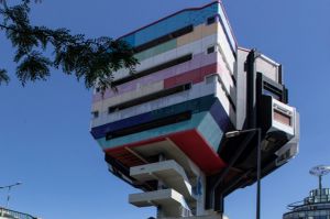 The distinctive building sits above a metro station.