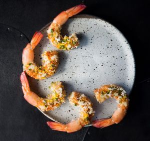 Ike Jime's riff on prawn cocktail, featuring grilled king prawns, dehydrated horseradish, cured duck egg yolk and lemon oil.