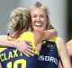 Back in the fold: Emily Hurtz celebrates with Jane Clayton during Australia's win over the United States.