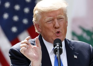 President Donald Trump speaks about the healthcare vote during a joint news conference with Lebanese Prime Minister Saad Hariri in the Rose Garden of the White House in Washington, Tuesday, July 25, 2017.