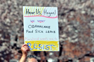 People protest through Maryland protesting President Donald Trump's plan to dismantle the Affordable Care Act (Obamacare)