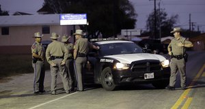 Law enforcement officials continue to investigate the scene of a shooting at the First Baptist Church of Sutherland Springs, Tuesday, Nov. 7, 2017, in Sutherland Springs, Texas.