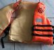 Dangerous fake Chanel brand "lifejackets" being sold in Africa to asylum seekers.