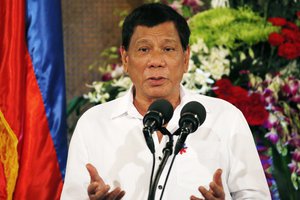 Philippine President Rodrigo Duterte gestures while addressing Filipino Muslim leaders during a reception at the Presidential Palace to celebrate the end of the Holy Month of Ramadan known as Eid al-Fitr in Manila, Philippines Tuesday, June 27, 2017.