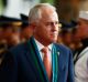 Malcolm Turnbull reviews the ceremonial guard in Manila during his welcome to Camp Aguinaldo to view a demonstration ...