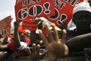 Protesters demonstrate against Zimbabwe President Robert Mugabe, in Johannesburg, South Africa, Saturday Aug. 16, 2008. Mugabe was in attendance at the opening ceremony of the 28th Southern African Development Community, SADC, summit of heads of state and government.