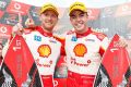 All smiles: Scott McLaughlin and Alex Premat of DJR Team Penske on the podium after their round 22 win in the Gold Coast 600.