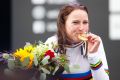 Gold medal winner Annemiek van Vleuten of the Netherlands poses on the podium.