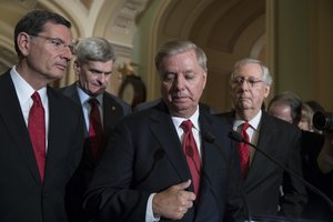 Sen. Lindsey Graham, R-S.C., center, joined by, from left, Sen. John Barrasso, R-Wyo., Sen. Bill Cassidy, R-La., and Senate Majority Leader Mitch McConnell, R-Ky., talked to reporters as they faced assured defeat on the Graham-Cassidy bill, the GOP's latest attempt to repeal the Obama health care law, at the Capitol in Washington, Tuesday, Sept. 26, 2017.